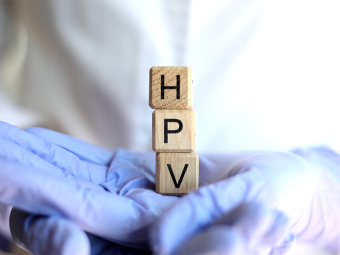 Doctor holding cubes with HPV text