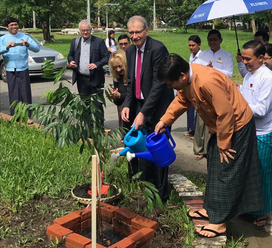 Scientia Professor David Cooper, Kirby Institute, with Ann Sudmalis and Myanmar partners partaking in local traditions.