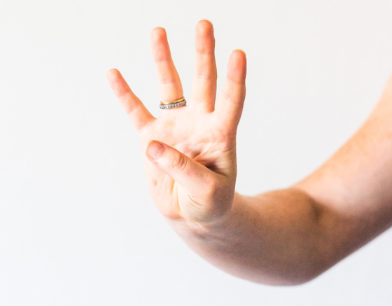 Hand with four fingers showing. Credit: Unsplash