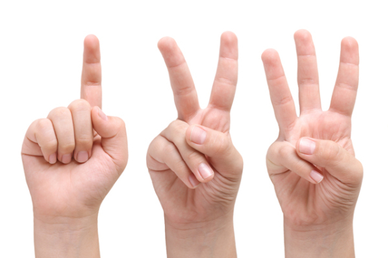 A set of three hands, counting one to three. Credit: AdobeStock