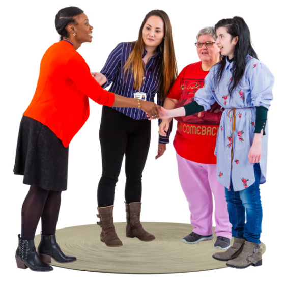 Facilitator holding hands with a group of people who have learning disabilities. Credit: Photosymbols 