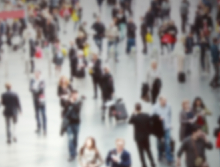 Blurry image of a large crowd of people. Credit: Shutterstock