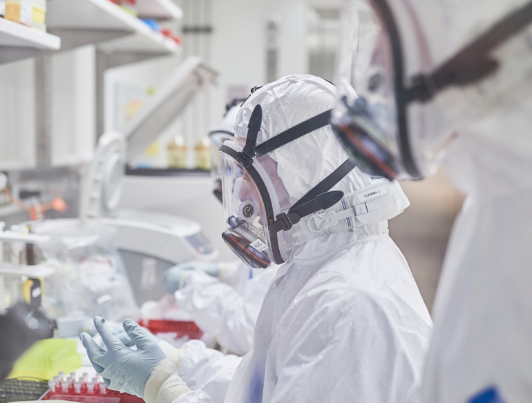 Scientists in PPE, working on COVID-19 in Kirby Institute's PC3 lab. Credit: UNSW/Richard Freeman