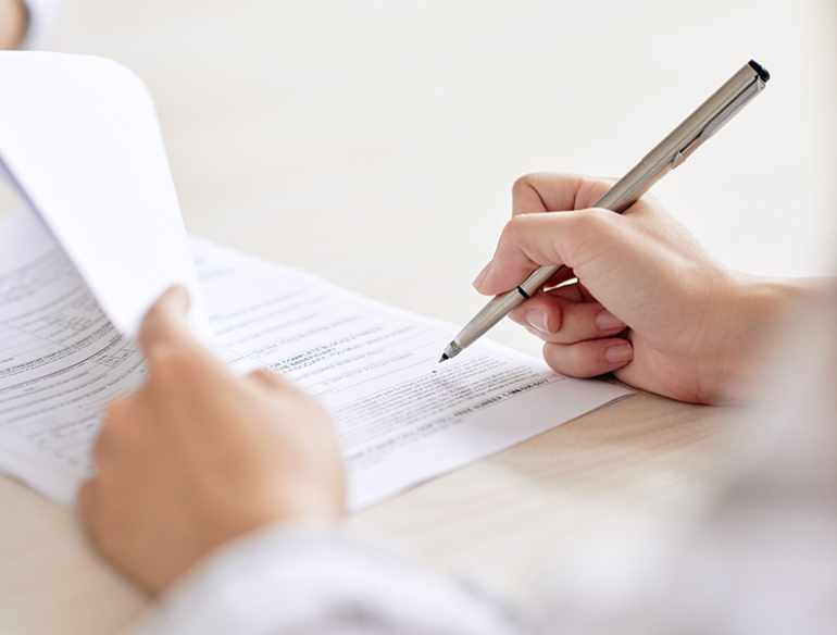 Man signing document