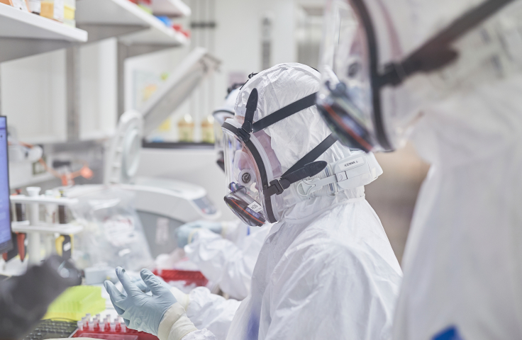 Scientists in PPE, working on COVID-19 in Kirby Institute's PC3 lab. Credit: UNSW/Richard Freeman