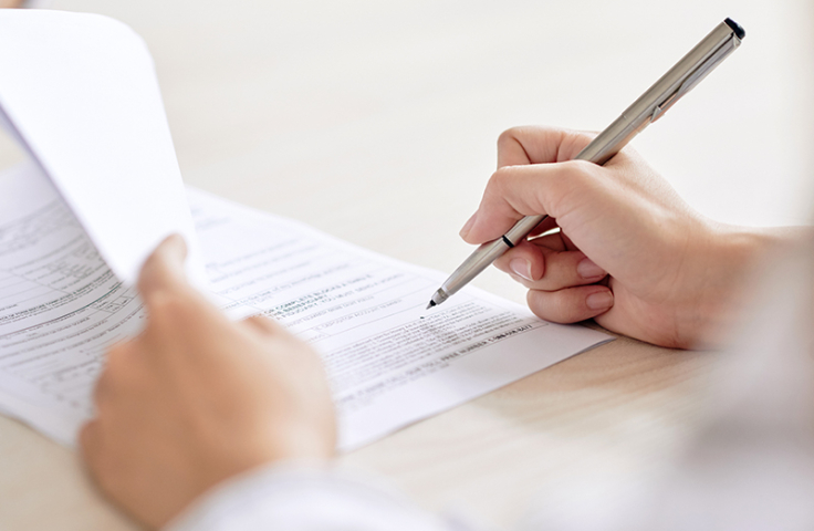 Man signing document