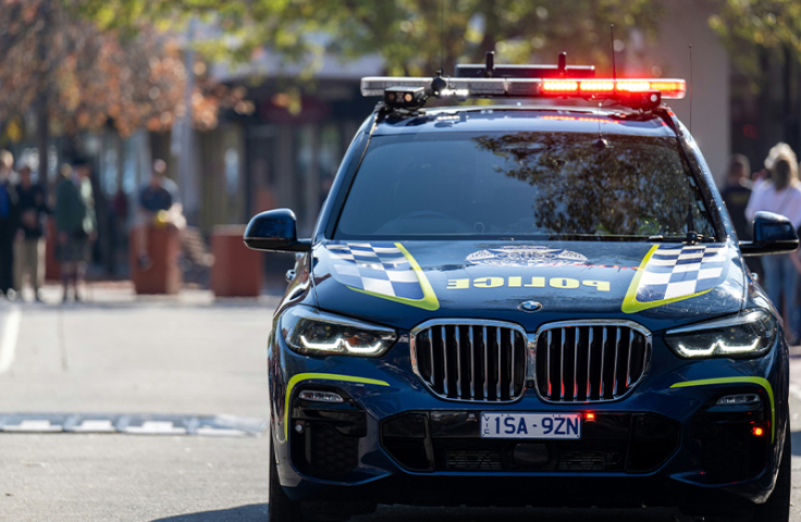 Shot of the front of a police vehicle with red light illuminated